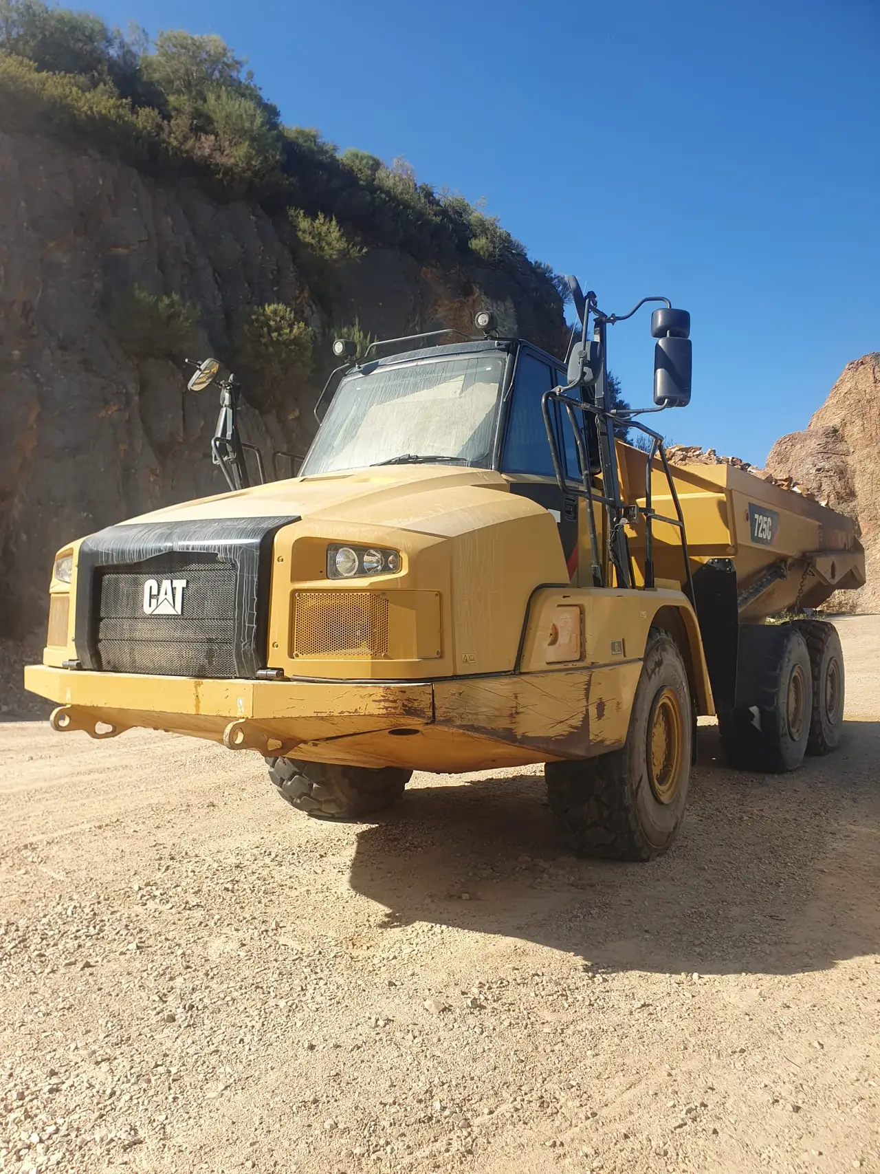 Heavy construction machinery in a real quarry